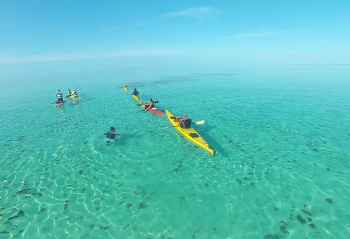 Kayak to snorkeling at Glovers Reef